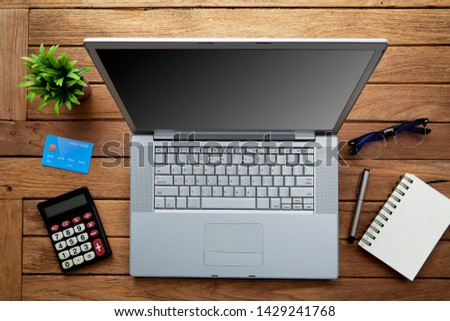 Office table with notepad, laptop and calculator, View from above with copy space