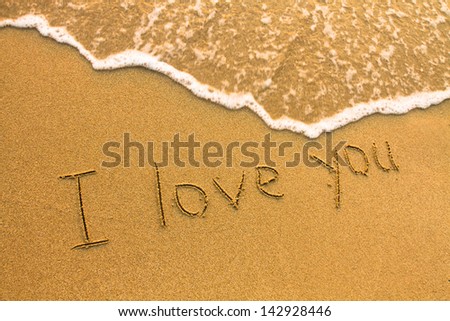 I love You - inscription on the beach sand, soft surf wave
