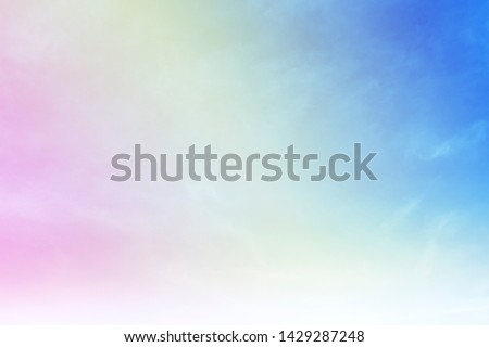 Abstract nature background of colorful pastel puffy & fluffy soft clouds on beautiful vivid & vibrant blue sky in morning sunlight & sun rays, fantasy & dreamy concept. Sunrise Gradient cloudy sky  Royalty-Free Stock Photo #1429287248