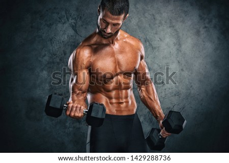 Muscular Men Lifting Weights. Studio Shot Royalty-Free Stock Photo #1429288736