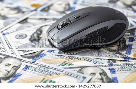 Wireless mobile mouse on 100 dollar background