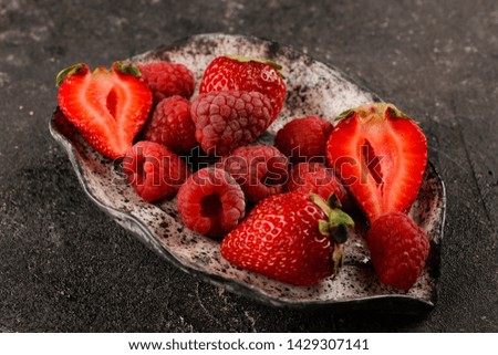 Raspberries and strawberry fresh summer fruit