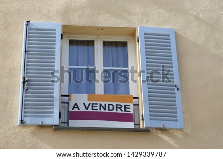 Apartment For Sale Sign (A Vendre In French Language) In Front Of An Apartment Building In Castellar, France, French Riviera, Europe