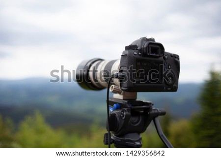camera on a tripod in the mountains