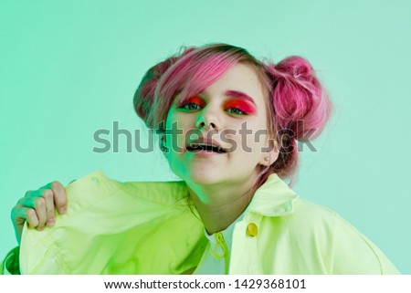 woman with pink hair joyful on green background portrait hairstyle
