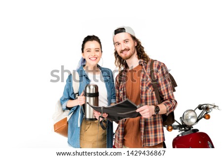 girl and young man looking at camera, holding thermos and standing near red scooter isolated on white
