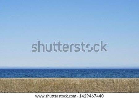 Image of an old embankment and the sea and sky Royalty-Free Stock Photo #1429467440