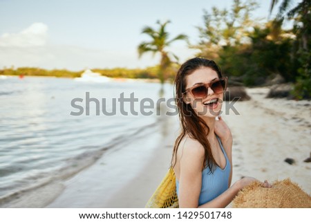 joyful woman in glasses with a hat nature trip                              