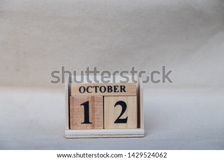 October 12th. Image of October 12 wooden color calendar on white canvas background. empty space for text