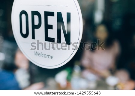 Open sign in coffee shop, Working in cafe.