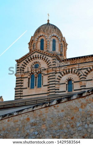 A series of 8 photos - a trace in the sky from the plane flying over Notre Dame de La garde Cathedral in Marseille, the Symbol of Marseille