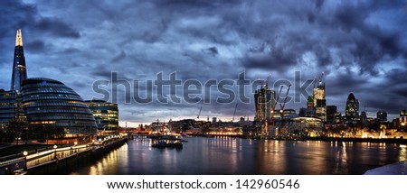  London at night , panoramic view from river.