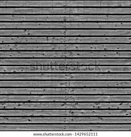 Old fence gray with damaged surface .Background or texture