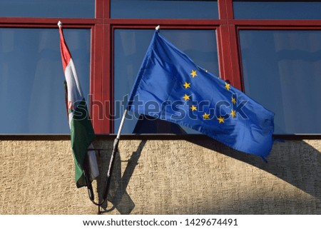 The flags of Hungary and the EU peacefully side by side