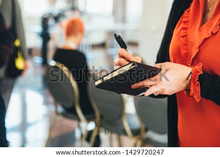 Professional Woman in Red Blouse Taking Notes, Working