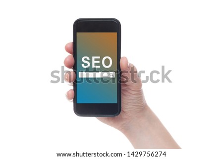 Hand holding black smartphone with text SEO (Search Engine Optimization) on smartphone screen. White backgroun. Seo concept