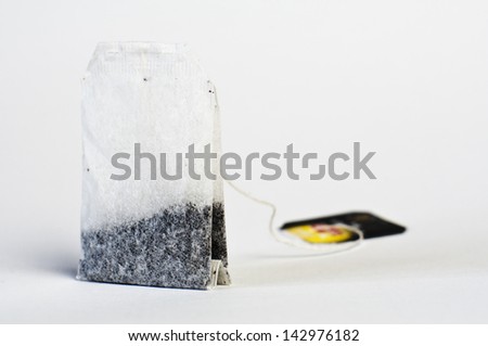 Teabag with tag on a white background