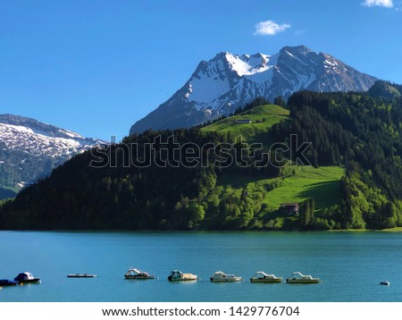 Boats on alpine Lake Wagitalersee or Waegitalersee, Innerthal - Canton of Schwyz, Switzerland