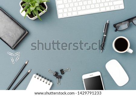 Overhead shot of business desktop with computer and mobile