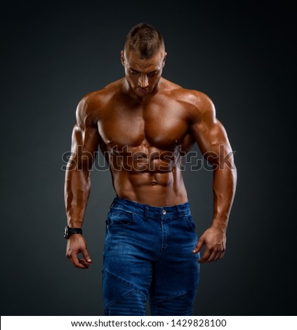 Shirtless, Athletic, Confident Handsome Man  Royalty-Free Stock Photo #1429828100