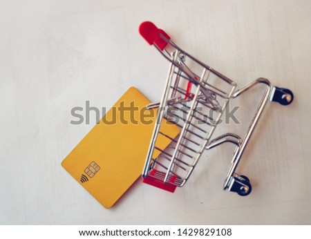 Shopping cart with a credit card.