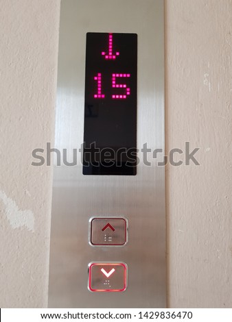 LED sign shows that an elevator is going down.