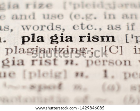 Dictionary definition of word plagiarism, selective focus. Royalty-Free Stock Photo #1429846085