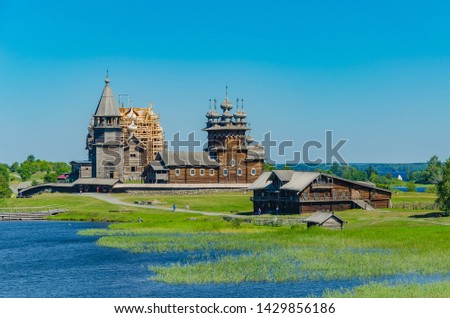 Kizhi Island, Karelia, Russia. The view from the water of a unique ancient architectural ensemble of traditional wooden folk architecture. UNESCO World Heritage Site in Russia.