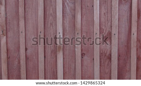 old wooden fence in the daytime in summer
