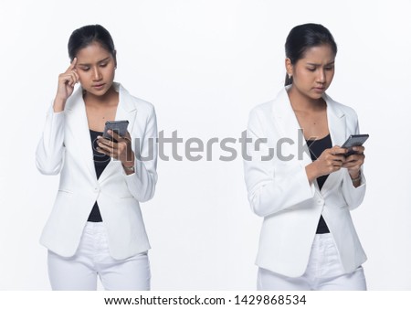 Portrait Half Body Snap Figure, Asian Business Woman Stand in White Formal proper Suit pants, studio lighting white background isolated, Lawyer Boss using smart phone bad news and stress serious issue