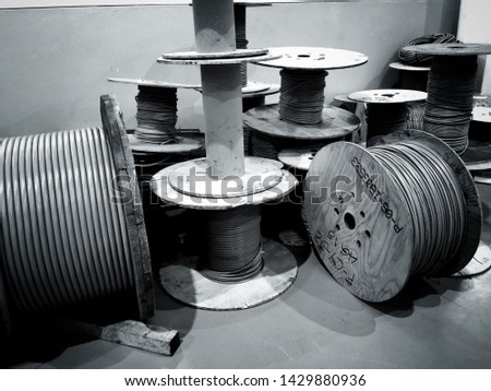 Black and white large power cable rolls in the industry