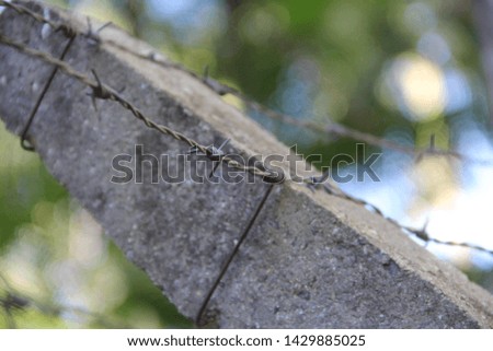 wires with tips attached to a concrete pole