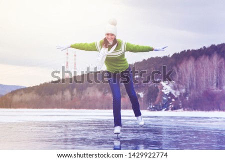 cheerful woman ice skating winter nature 