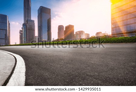 empty road with modern highrise in city,shenzhen,China.