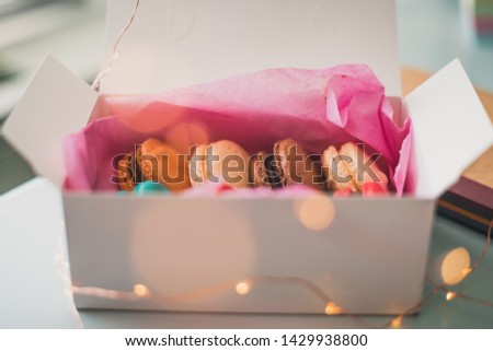 colorful macarons with a gift box
