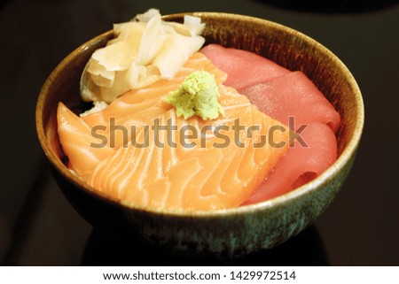 'Salmon and Tuna Don', Japanese rice bowl with pieces of raw salmon & tuna and add wasabi (Japanese horseradish), fresh ginger for more taste. 