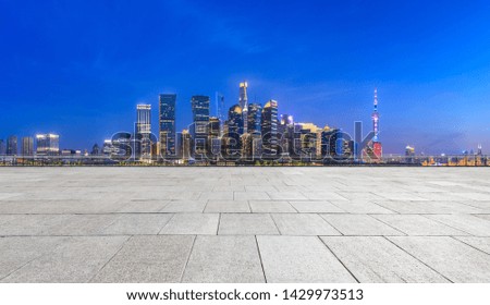 Shanghai skyline and modern city skyscrapers with empty floor at night,China