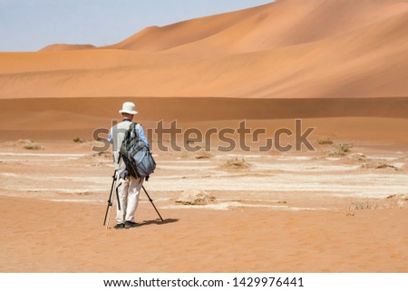 The photographer is shooting in the desert, Namibia