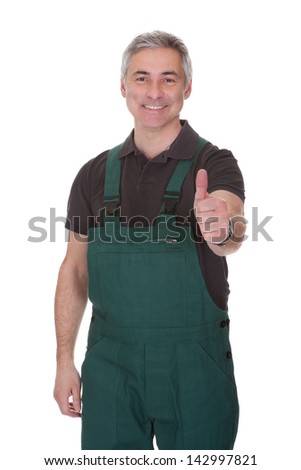 Mature Male Gardner Showing Thumb Up Sign Over White Background