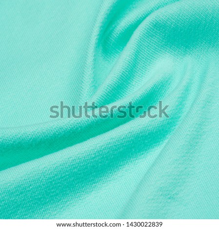 Texture, background, pattern. The fabric is knitted blue, turquoise, blue. I will add a creative approach to your next project. With this fabric, you will be the first, gentle color that you need