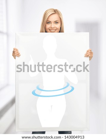 beautiful woman holding picture of dieting woman
