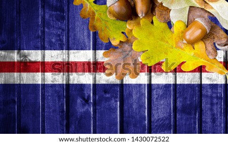 Cape verde flag on autumn wooden background with leaves and good place for your text.