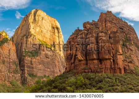 A view of the amazing Angel's Landing from the canyon floor at Zion National Park, USA against a beautiful bright blue sky against a bright blue sky