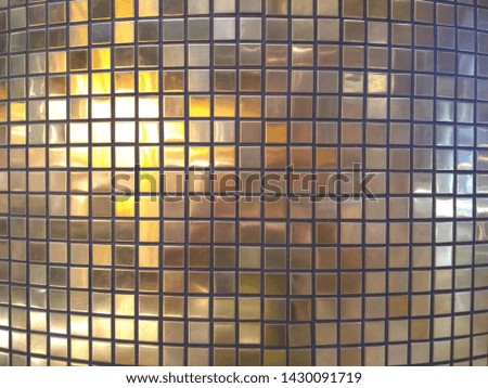 Gold tiles decorated on the wall