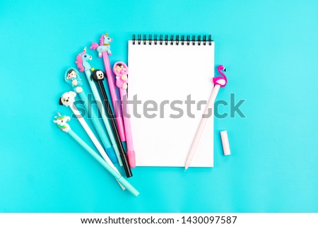 set of pens and notebook on blue background Place for text Flat lay Top view Goals,Means, Resolution concept Back to school  Stationery