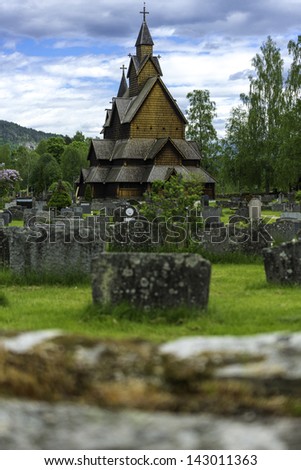 A view of the church in Heddal, his yard and cemetery.