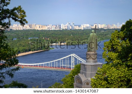 Panoramic view of the Dnieper river, the pedestrian bridge, and the "Vladimir The Great Monument". Kiev, Ukraine.
