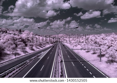 Surrealistic looking city landscape with a modified digital SLR camera that records only the infrared spectrum of light creating a special visionary. Highway reaching Brno city, Czech Republic.