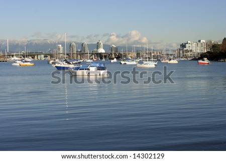 Science World and False Creek in Vancouver with sailboats anchored