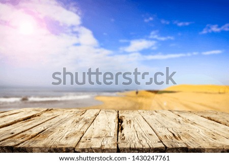 Desk of free space and summer time on beach. Ocean landscape and sunny day. 